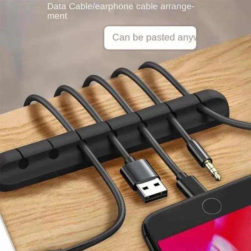 Adhesive Cord Manager for Mobile Devices