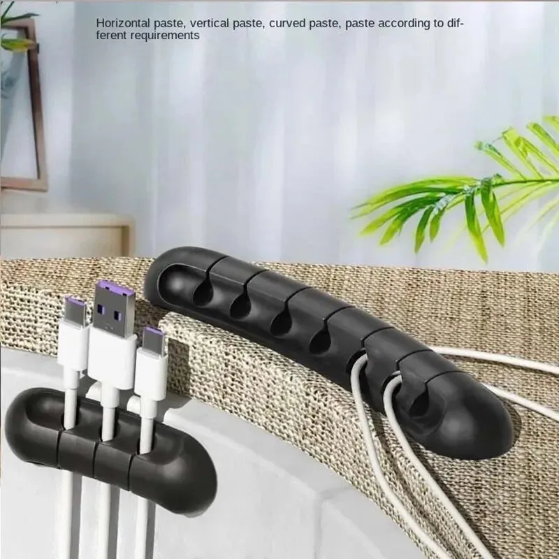 Adhesive Cord Manager for Mobile Devices